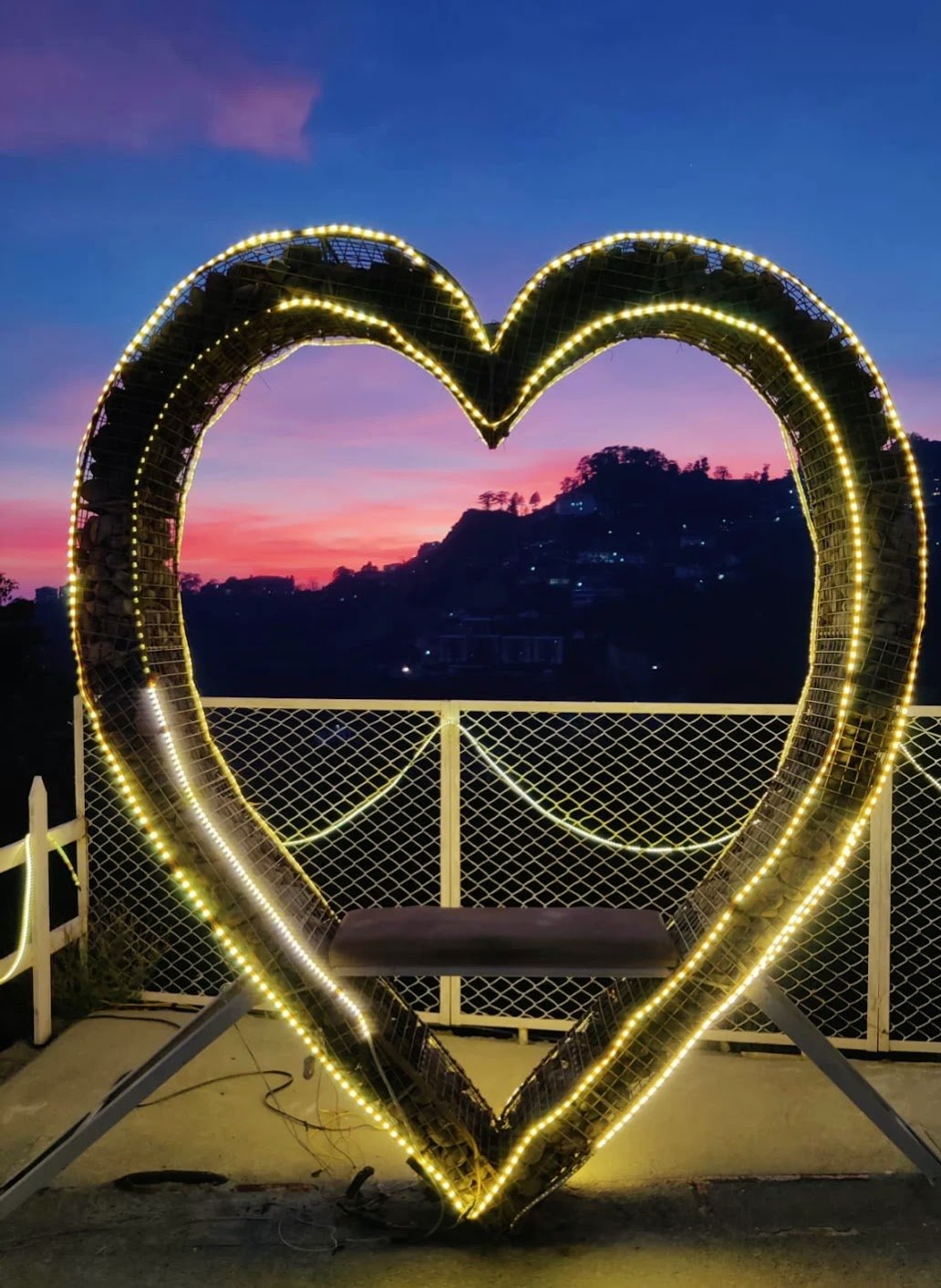 Heart-shaped light installation at dusk, Annfield Cottage